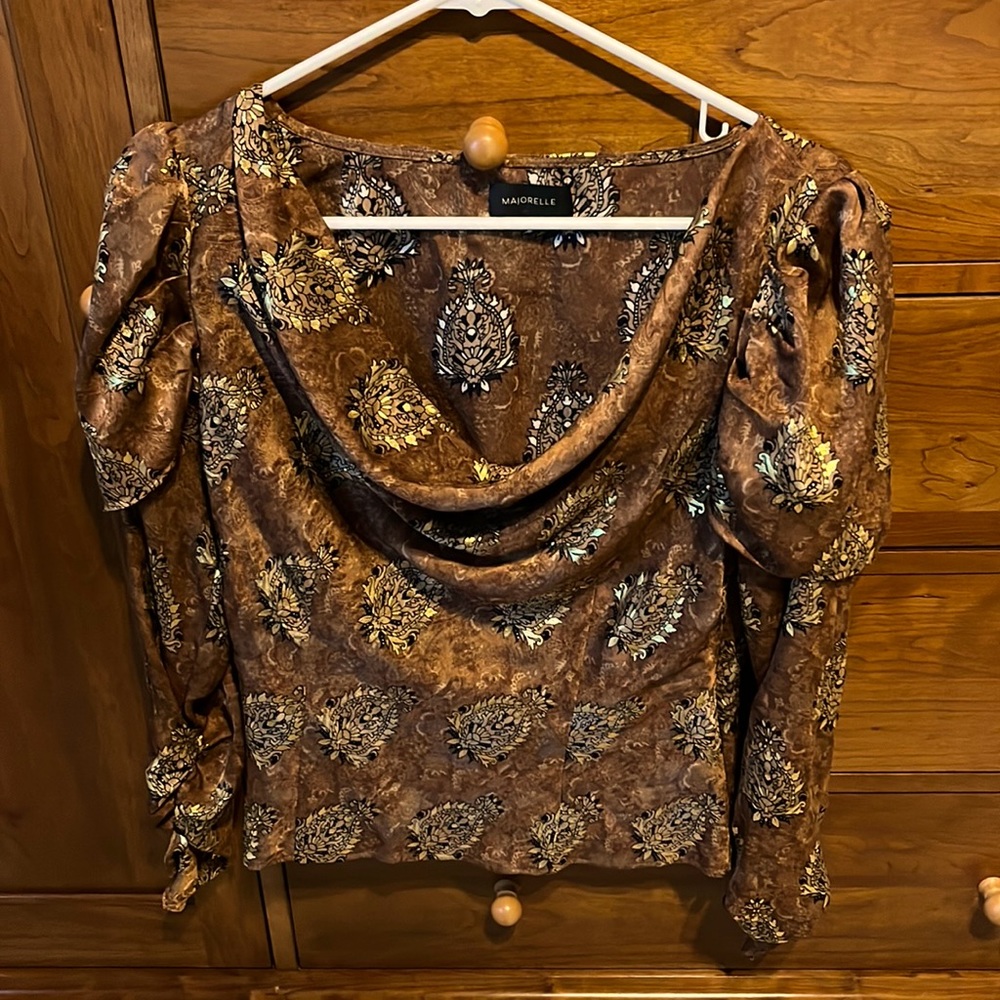 Size S blouse. It has gold highlights and a lot of detail.